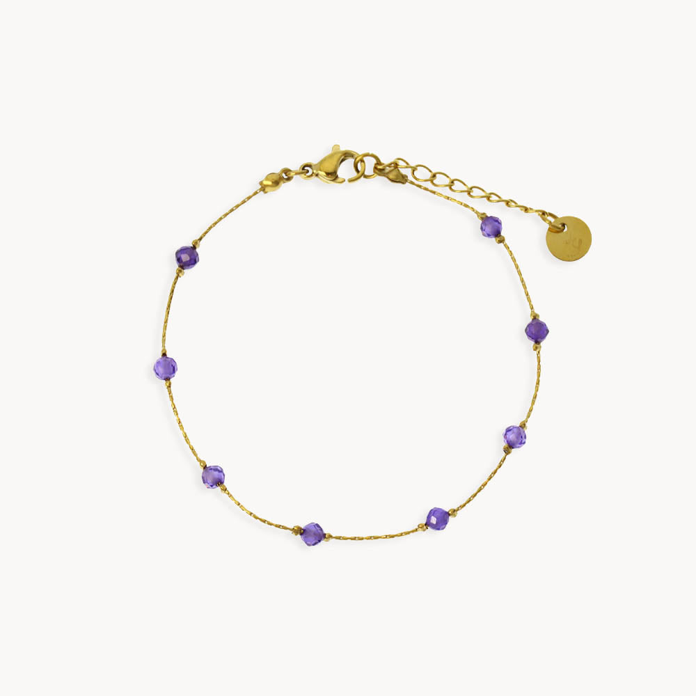 Gold bracelet with purple crystal beads