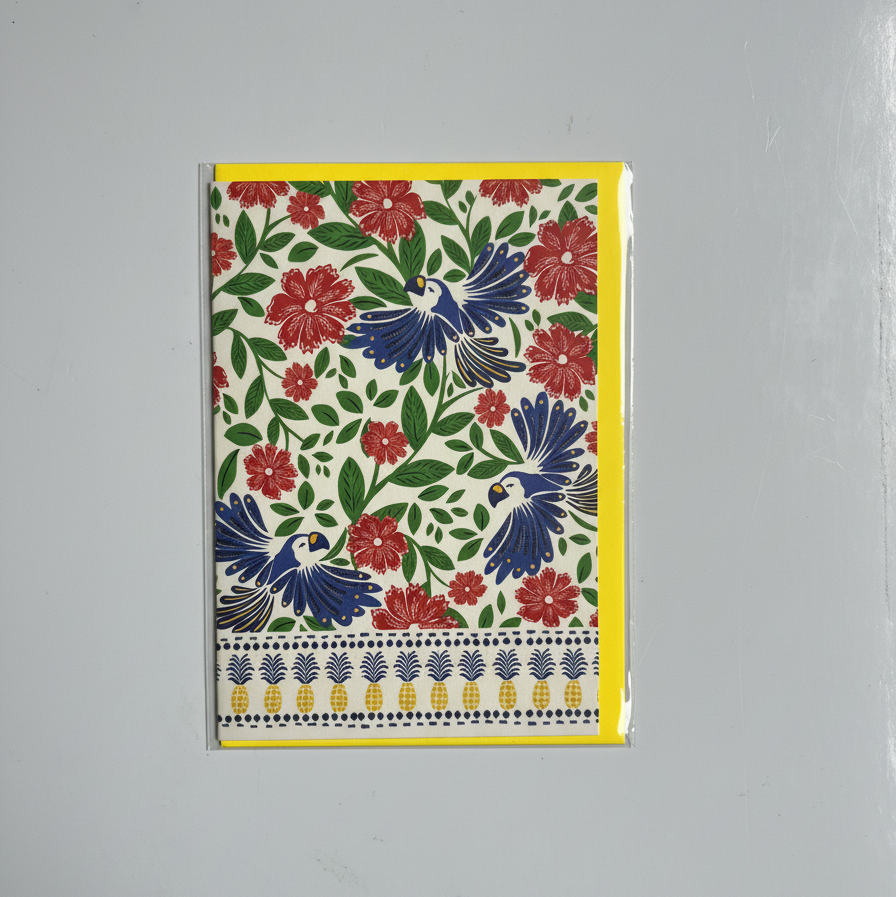 Floral and bird patterned greeting card on a gray background