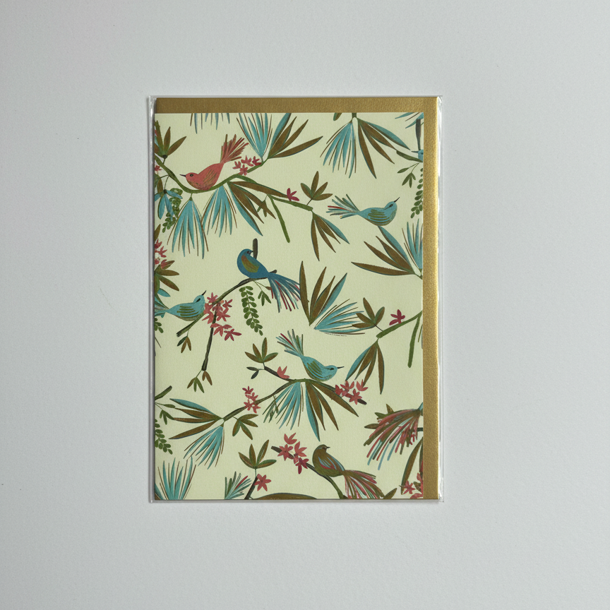 Greeting Card with bird and floral pattern on a plain background
