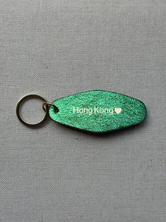 Iridescent Green Leather Keychain with Hong Kong on it