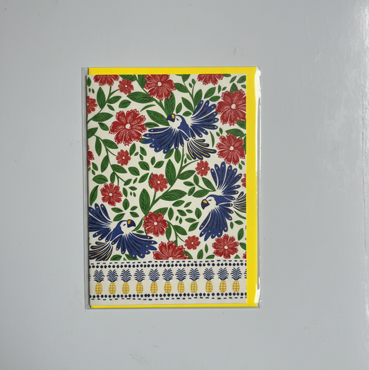 Floral and bird patterned greeting card on a gray background