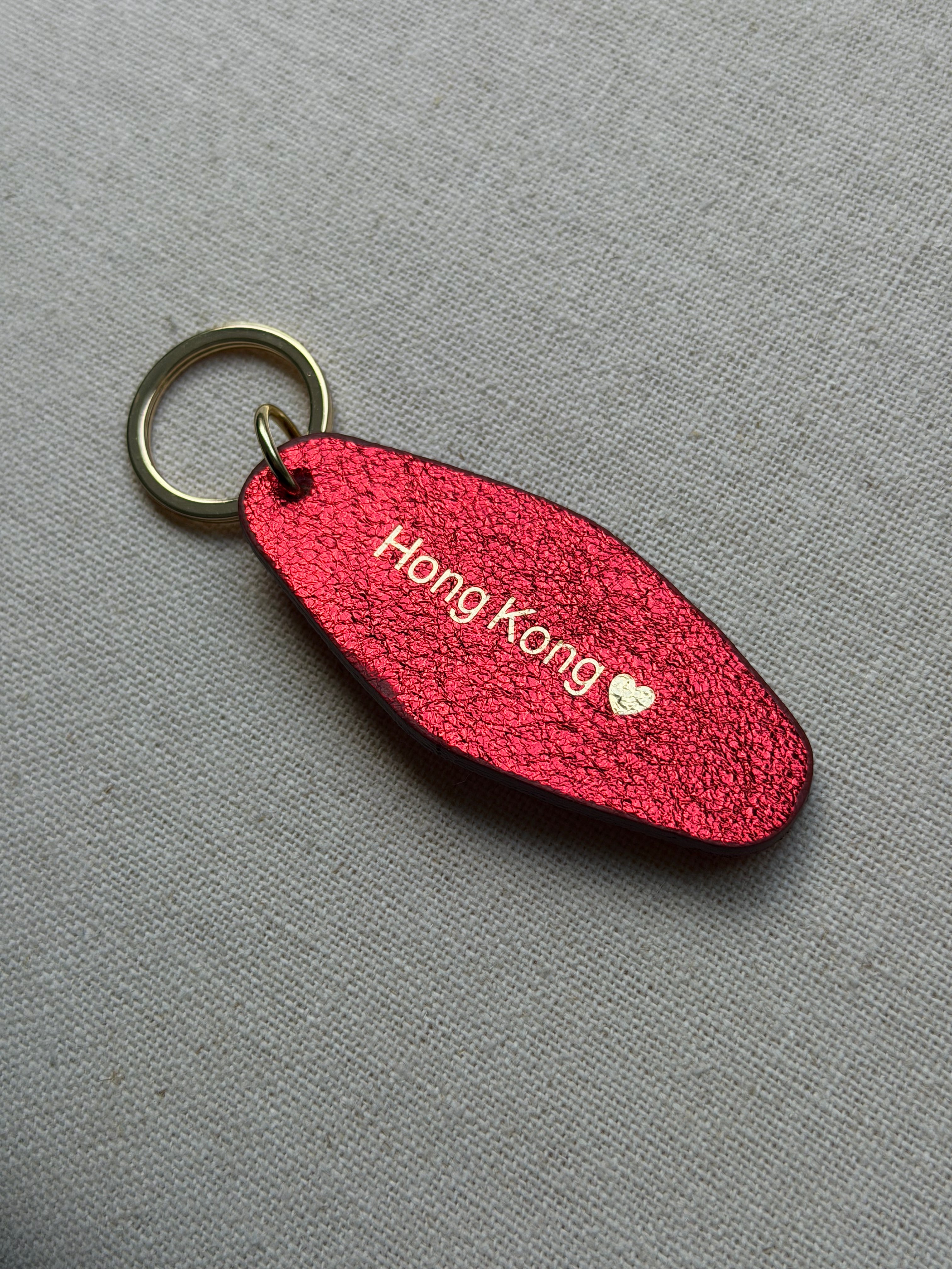 Iridescent red Leather Keychain with Hong Kong on it
