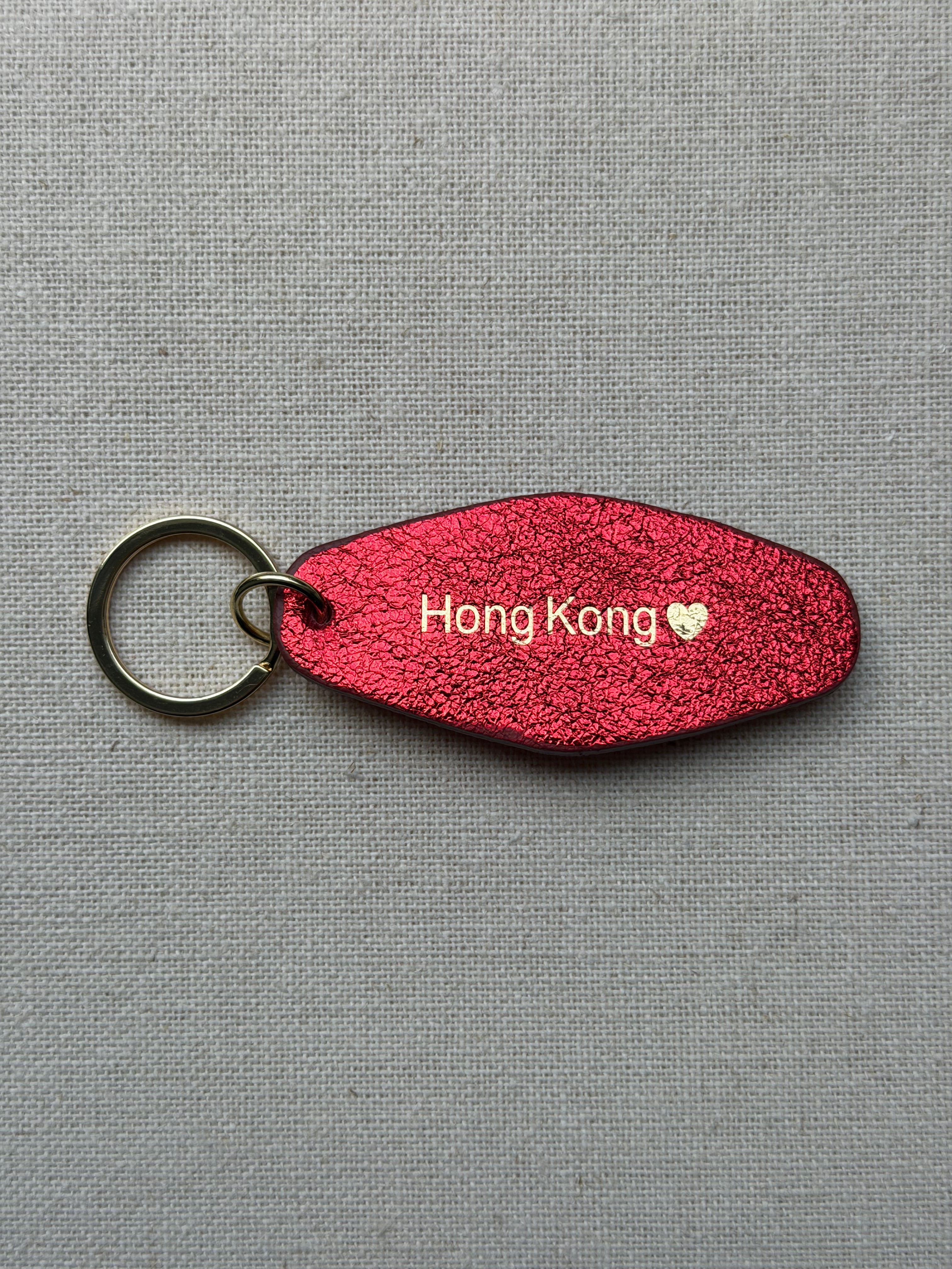 Iridescent red Leather Keychain with Hong Kong on it

