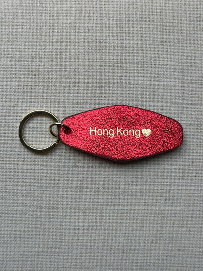 Iridescent red Leather Keychain with Hong Kong on it
