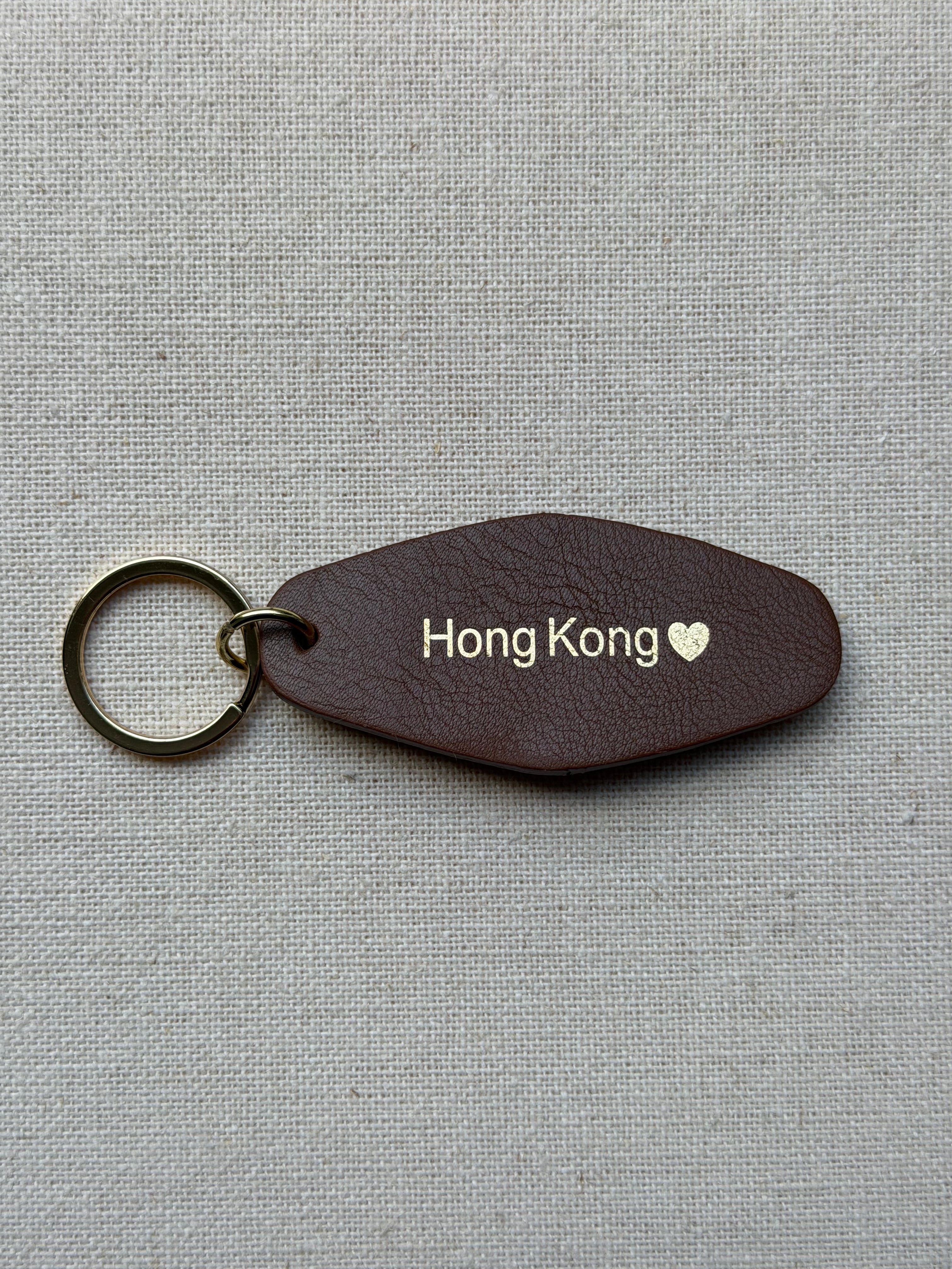 brown Leather Keychain with Hong Kong on it