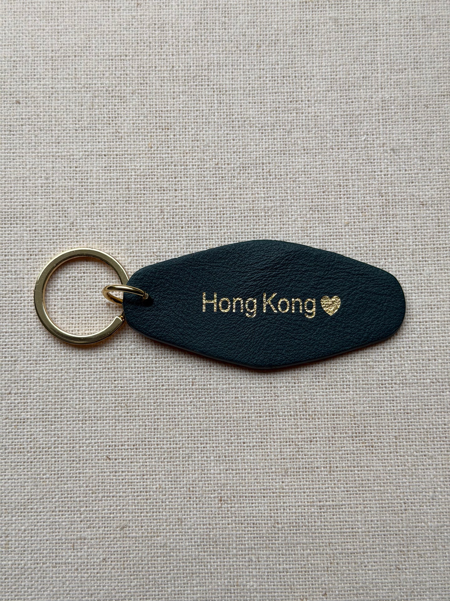 Dark Green Leather Keychain with Hong Kong on it