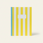 Notebook with yellow and blue striped cover on a white background