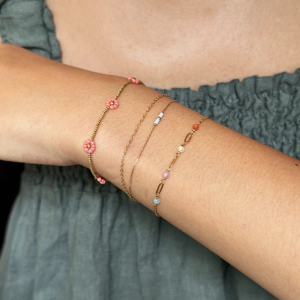 bracelet stack of coral prairie and two other chain bracelets