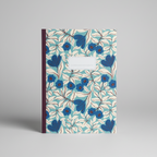 Notebook with blue floral pattern on a gray background