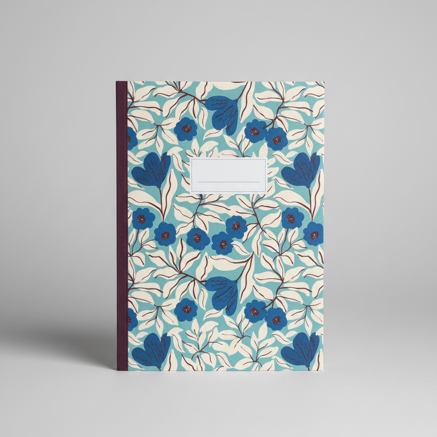 Notebook with blue floral pattern on a gray background