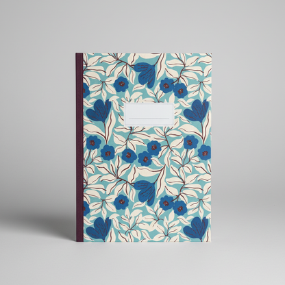 Notebook with blue floral pattern on a gray background