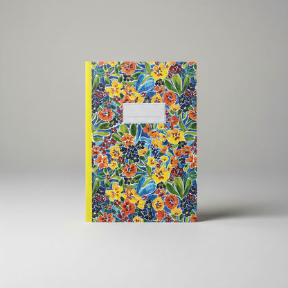 Floral-patterned notebook with a yellow edge on a gray background