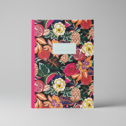 Notebook with a colorful floral and fruit pattern on a gray background
